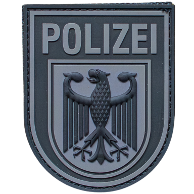 Abzeichen der Polizei mit einem Adler und dem Schriftzug "POLIZEI".