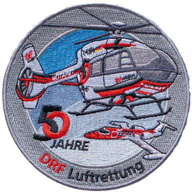 Logo zum 50-jährigen Jubiläum der DRF Luftrettung mit Hubschraubern.