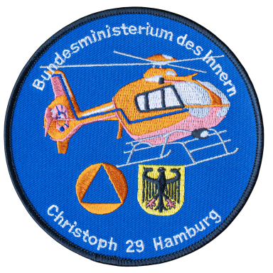 Wappen des Bundesministeriums des Innern mit einem Hubschrauber und einem Wappen.