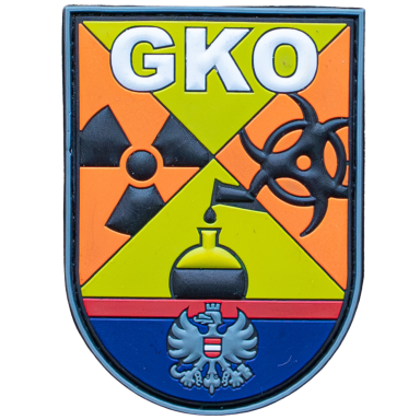 Wappen mit den Symbolen für radioaktive, biologische und chemische Gefahren.