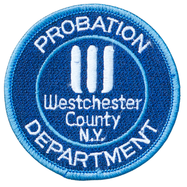 Abzeichen des Probationsdienstes von Westchester County, NY, in Blau mit weißer Schrift.