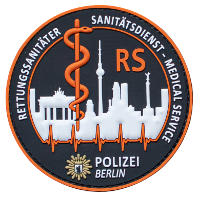 Abzeichen für Rettungsdienst in Berlin mit Symbolen für Gesundheit und Sicherheit.