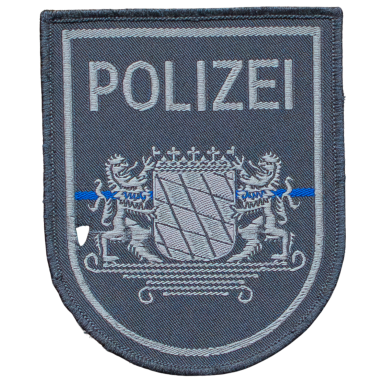 Abzeichen der Polizei mit Wappen und blauer Linie.