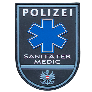 Abzeichen der Polizei mit blauem Stern und der Aufschrift „Sanitäter Medic“.