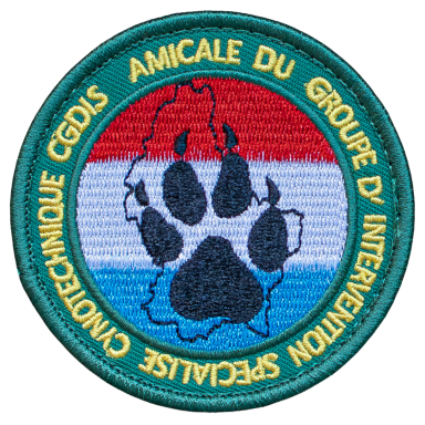 Runder Aufnäher mit Pfotenabdruck und rot-blauem Hintergrund.