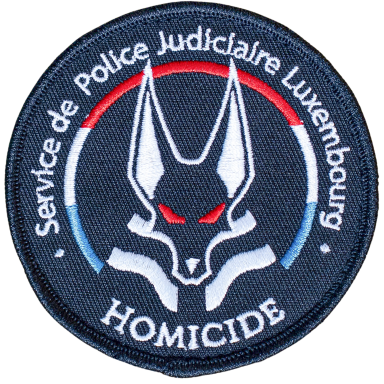 Abzeichen der luxemburgischen Polizei mit einem grauen Wolf und dem Schriftzug "HOMICIDE".