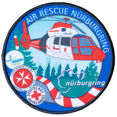 Abzeichen der Luftrettung Nürburgring mit Hubschrauber und Naturmotiven.