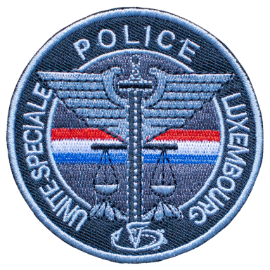 Wappen der luxemburgischen Spezialpolizei mit Schlangensymbol und Waage.