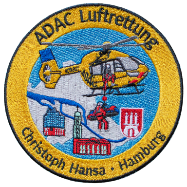 Logo der ADAC Luftrettung mit einem Hubschrauber über einer Stadtansicht.