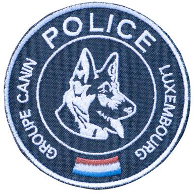 Abzeichen der Luxemburger Polizei, zeigt einen Schäferhund und den Schriftzug "Groupe Canin".