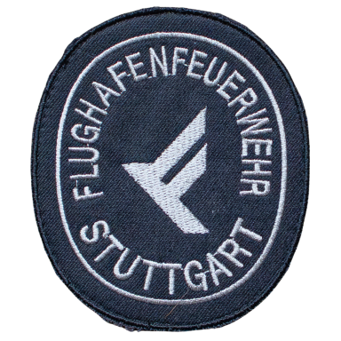 Abzeichen der Flughafenfeuerwehr Stuttgart mit stilisiertem Flugzeug-Symbol.