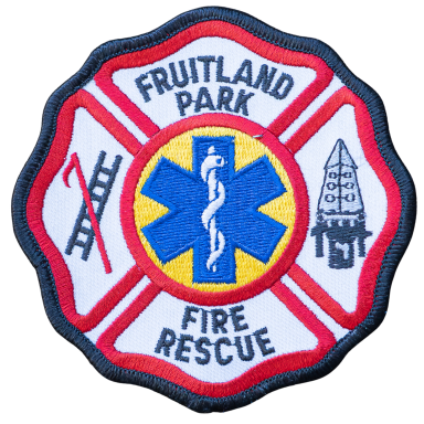 Abzeichen der Fruitland Park Feuerwehr mit Rettungssymbol und Feuerwehrhelm.