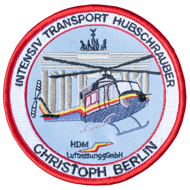 Abzeichen eines Intensivtransport-Hubschraubers mit dem Brandenburger Tor im Hintergrund.
