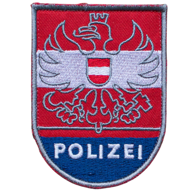 Wappen der Polizei mit einem Adler und dem Wort "POLIZEI" in Blau.