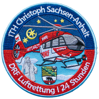Logo des DRF Luftrettungsdienstes mit einem Hubschrauber und sächsischem Wappen.