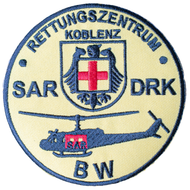 Wappen des Rettungszentrums Koblenz mit Hubschrauber und Kreuzsymbol.