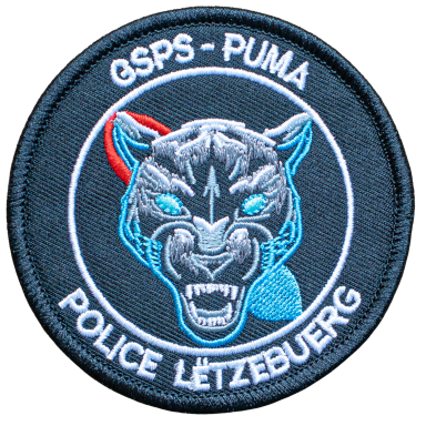 Emblem der Polizei Luxemburg mit einem Pantherkopf und dem Schriftzug "GSPS - PUMA".