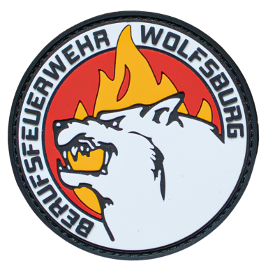 Wappen der Berufsfeuerwehr Wolfsburg mit Wolf und Flammenmotiv.