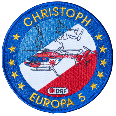 Logo des DRF Luftrettungsdienstes mit einem Hubschrauber und den Farben Blau, Rot und Weiß.