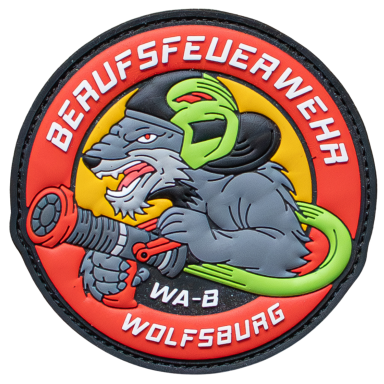 Abzeichen der Berufsfeuerwehr Wolfsburg mit einem Wolf, der einen Feuerlöscher hält.