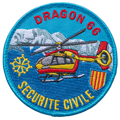 Abzeichen von Dragon 66 mit einem Rettungshubschrauber vor einer Berglandschaft.