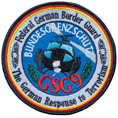 Abzeichen der Bundesgrenzschutz GSG 9 mit einem Wappen und Schriftzug.