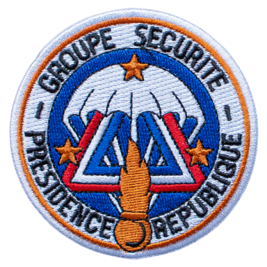 Abzeichen mit einem Paragleiter, Sternen und dem Text „Groupe Sécurite Présidentielle“.