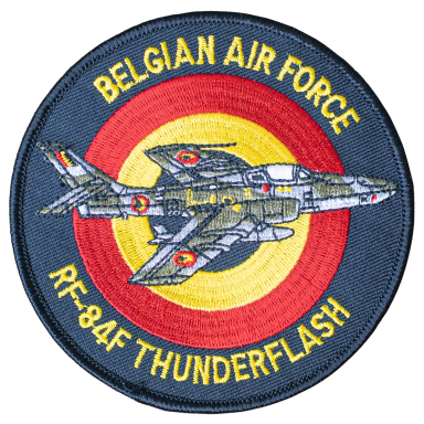Emblem der belgischen Luftwaffe mit RF-84F Thunderflash und farbigen Ringen.