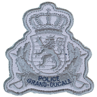 Wappen der Grand-Ducale Polizei mit Krone und stilisiertem Löwen.
