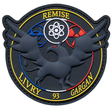 Schwarzes Emblem mit einem geflügelten Wesen und Symbolen für Wissenschaft und Gefahr.