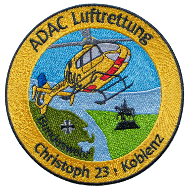 Emblem der ADAC Luftrettung mit Hubschrauber und solidarischem Kreuz, Standort Koblenz.